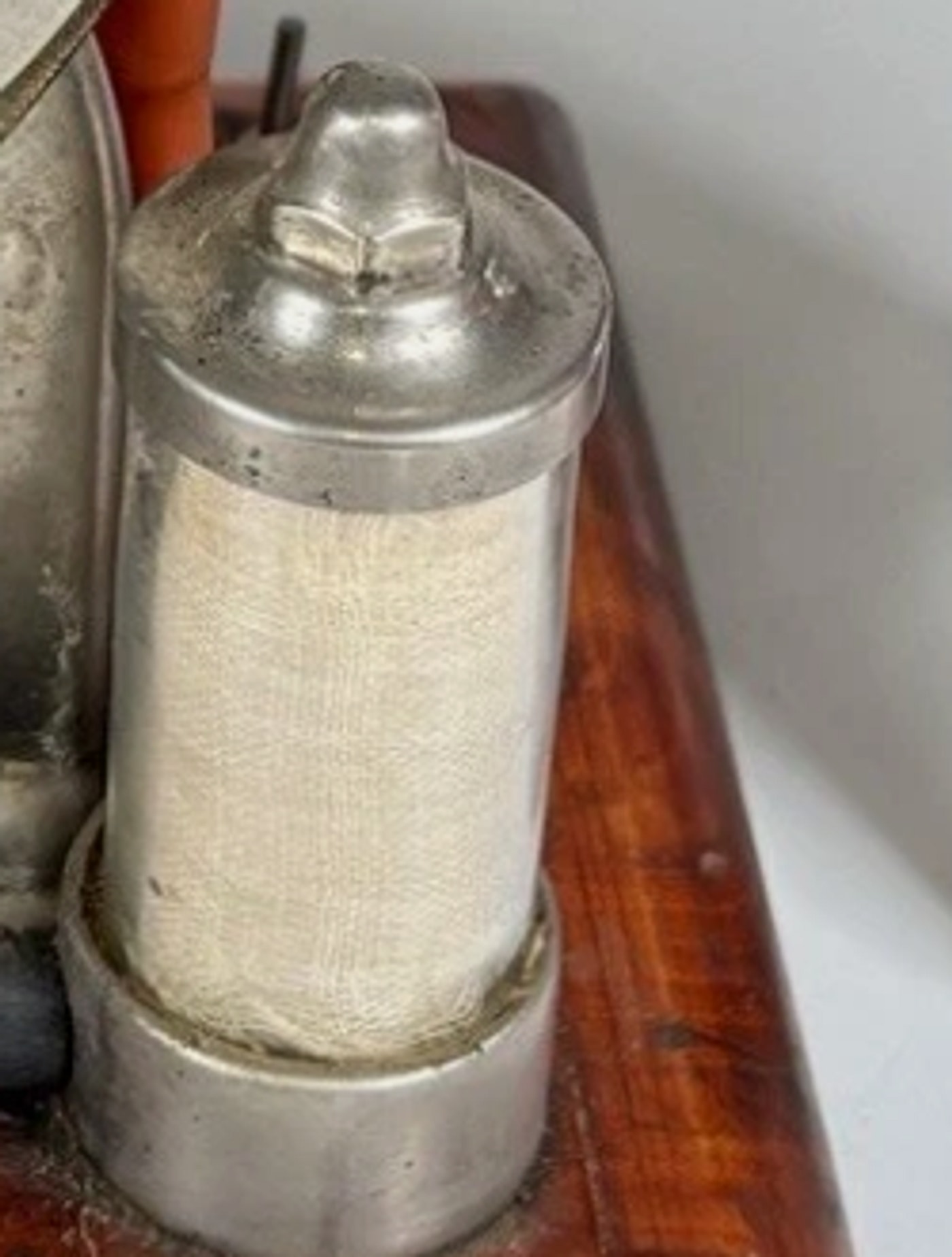Figure 2 — One of the two nickel "air purifiers," one per circuit. The count is the whole identification: two canisters makes this a No. 60, four makes it the larger No. 460.