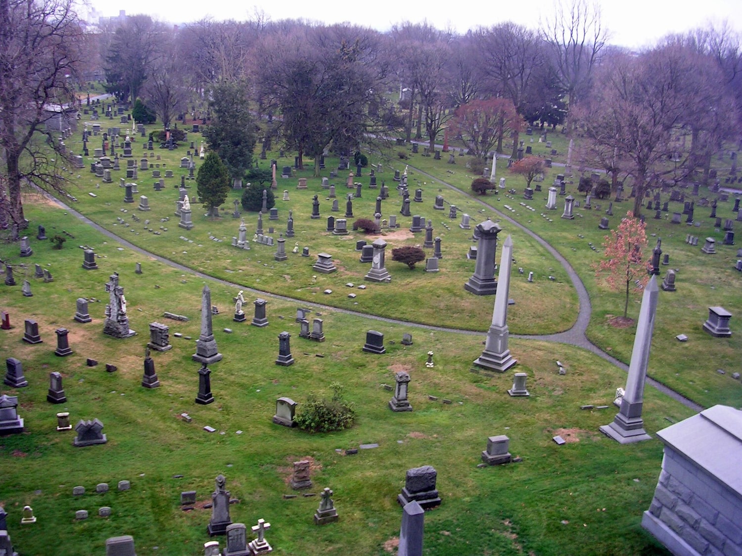 Figure 4 — Green-Wood Cemetery, Brooklyn — one of the great rural-cemetery landscapes laid out in the arsenical decades. The relevance is chemical, not sentimental: ground like this received the metal salts o…